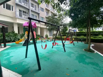 a playground in a pool of water with swings at Hotel Luxury Twin Bed Room with Balcony Las Pinas-South Residence in Manila