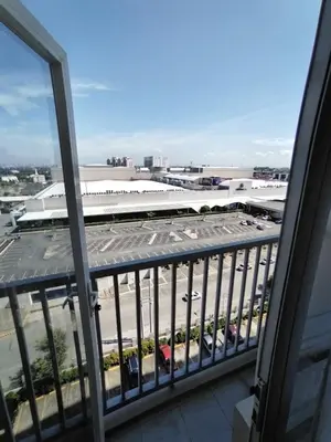 a view of a parking lot from a balcony at Hotel Luxury Twin Bed Room with Balcony Las Pinas-South Residence in Manila