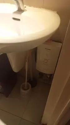 a bathroom with a sink and a box under it at Azure Urban Residence A11 Near Airport and SM Bicutan+ Free wifi in Manila