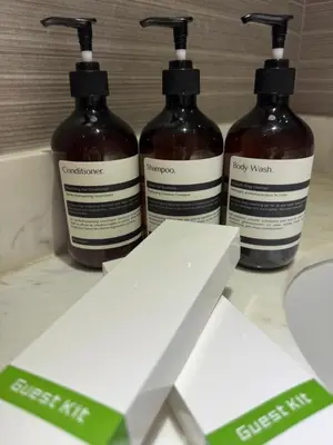 a group of three bottles of soap on a counter at Modern 1BR Executive Suite l Best City View of BGC l The Residences BCCT in Manila