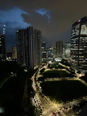 a city skyline at night with tall buildings at Modern 1BR Executive Suite l Best City View of BGC l The Residences BCCT in Manila