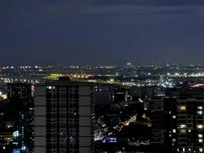 a view of a city at night with lights at Penthouse Lvl Luxury Cndo Nr MOA in Manila