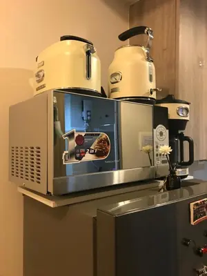 a microwave with two toasters on top of it at Penthouse Lvl Luxury Cndo Nr MOA in Manila