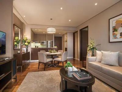 a living room with a couch and a table at Ascott Bonifacio Global City Manila in Manila