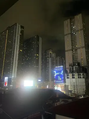 a city skyline at night with tall buildings at Eco Friendly Studio Rooms Edsa Mandaluyong Shaw at F Residences under New Management in Manila