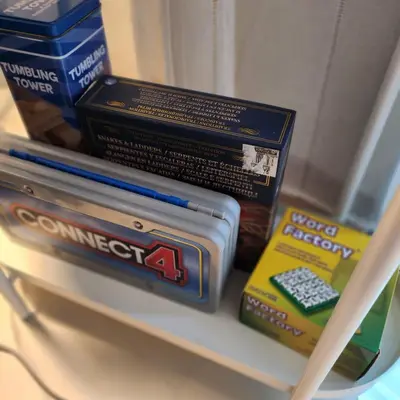 a couple of boxes sitting on top of a shelf at My Humble Abode at Shore 3 in Manila