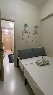 a bedroom with a bed in a room at CHATEAU ELYSEE A16 Near Resto And Sm Mall/Airport in Manila