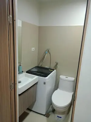 a bathroom with a toilet and a sink at 1Bedroom Cozy Condo near MOA in Manila