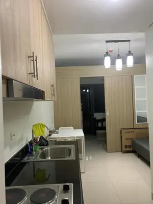 a kitchen with a sink and a counter top at SHORE RESIDENCE D17 shortwalk Mall of asia near airport in Manila