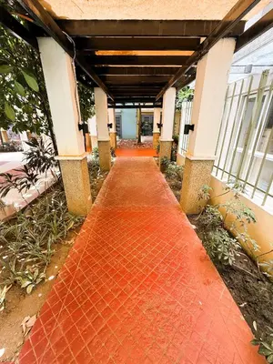 a red brick walkway in the middle of a building at JFam Suites, C3-11D Studio, Up To 4 Pax in Biñan