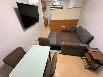 a small living room with a couch and a table at Condo in Pasig - One Oasis Staycation in Manila