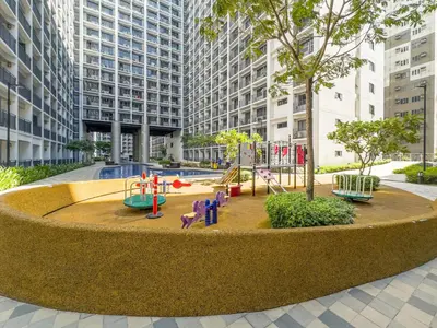 a playground in the middle of a city with tall buildings at GemstoneBR in SMDC Shore 2 Residences in Manila