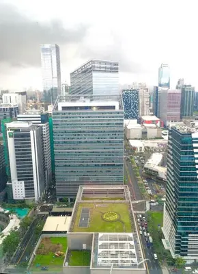 an aerial view of a city with tall buildings at One bedroom budget condo in BGC in Manila