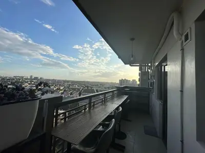 a balcony of a building with a view of a city at Condo in Taguig, 2br condo, Acacia Estates, BGC, in Manila