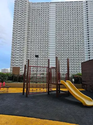 a playground with a slide in front of a building at Jamellas' Smile Home in Manila