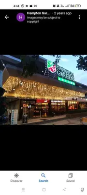 a store with christmas lights on the front of it at Nathan's Staycation in Manila
