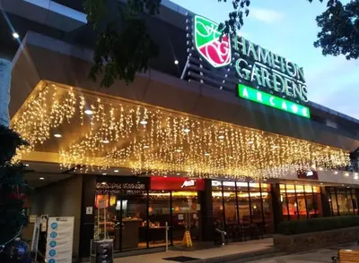 a shopping center with christmas lights on the facade at Nathan's Staycation in Manila