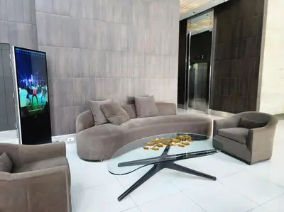 a living room with a couch and two chairs and a table at BGC Avant at The Fort Cosy and Vibrant 2BR near Burgos Circle in Manila
