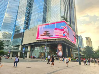 a crowd of people walking in front of a building at BGC Avant at The Fort Cosy and Vibrant 2BR near Burgos Circle in Manila