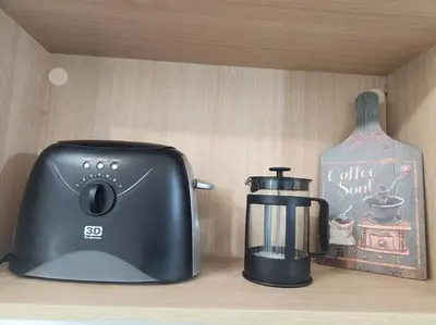 a toaster sitting on a counter next to a coffee maker at BGC Avant at The Fort Cosy and Vibrant 2BR near Burgos Circle in Manila