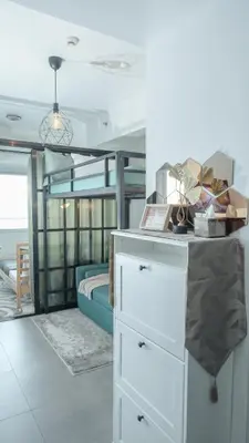 a bedroom with a bunk bed and a white dresser at Casa Roma Manila in Manila