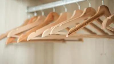 a bunch of wooden hangers in a closet at Casa Roma Manila in Manila