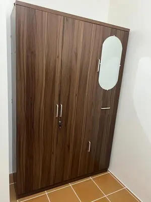 a wooden door in the corner of a bathroom at Relaxing Haven at Covent Garden in Manila