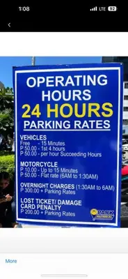 a sign for a parking hours and parking rates at Chic and Cozy 1BR Shore 3 by SMDC near MOA in Manila