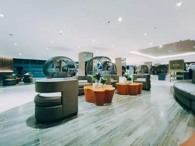 a lobby with couches and tables in a store at MALL OF ASIA 1156 Affordable Staycation DYNASTEL SHORE in Manila