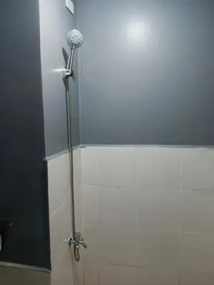 a shower stall in a bathroom with a shower at K2K place in Manila