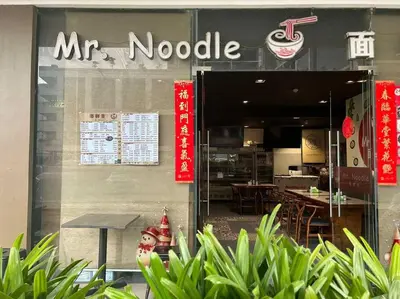 a mr noodle restaurant with a sign in the window at MOA ARENA 1151 DYNASTEL SHORE Staycation in Manila