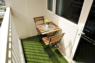 a balcony with a table and two chairs on a porch at MOA ARENA 1151 DYNASTEL SHORE Staycation in Manila