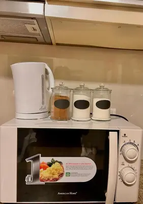a microwave with a picture of food on top of it at Condotel Across Naia T3 at ONE PALM TREE VILLA CLUSTER B in Manila