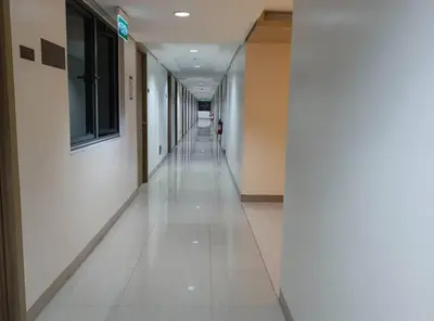 an empty hallway of a building with a long corridor at Philippine International Convention Center 676 DYNASTEL SHORE in Manila