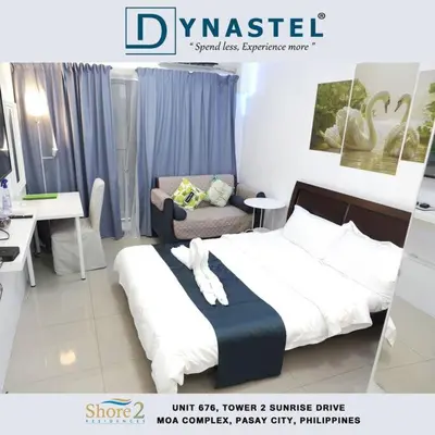 a poster of a bedroom with a bed and a desk at Philippine International Convention Center 676 DYNASTEL SHORE in Manila