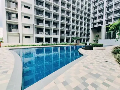 a swimming pool in front of a building at SHORE RESIDENCES HOTEL Staycation 621 Dynastel in Manila