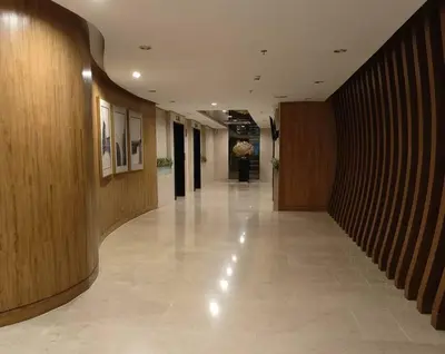 a hallway of a building with wooden walls and a hallwayasteryasteryasteryasteryastery at MALL OF ASIA 774 DYNASTEL SHORE Staycation in Manila