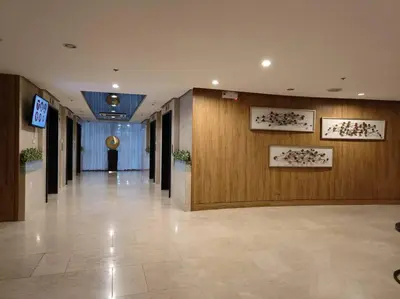 a hallway of a building with a lobby with wooden walls at CONDOTEL STAYCATION 793 Pasay DYNASTEL in Manila