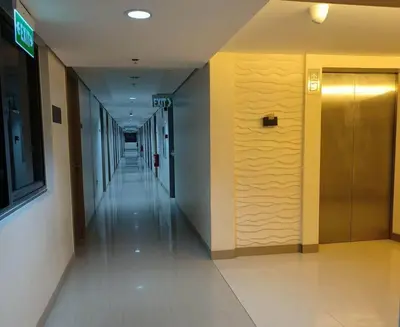 an empty hallway of a building with a elevator at NAIA AIRPORT MOA 1278 DYNASTEL SHORE Staycation in Manila