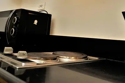 an apple computer sitting on top of a tray with coins at Pasay MOA 1486 Dynastel Shore Staycation in Manila