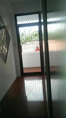a door with a window in a room at 4jMarte Home Stay in Imus