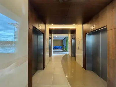 a hallway of a building with a view of the ocean at GRAND RIEVERA SUiTES in Manila
