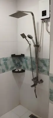 a shower in a bathroom with a shower head at 6 Guest - Unit 2 Studio type in Santa Rosa
