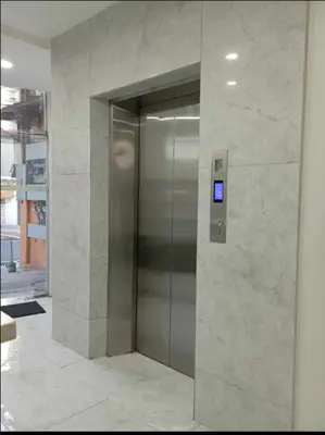 a elevator in a building with a sign on it at St. Marvin Studio Makati M408 in Manila