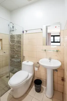 a bathroom with a toilet and a sink at St. Marvin Studio Makati M403 in Manila