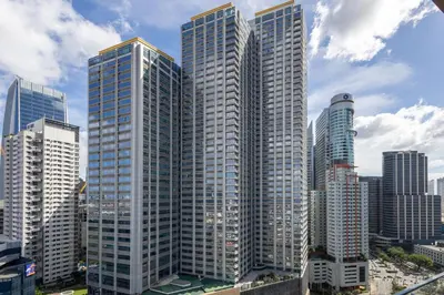 a group of tall buildings in a city at Lush Residences Makati in Manila