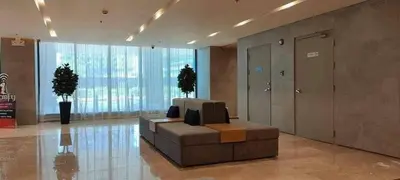 a lobby with a couch in the middle of a building at S Residence Condo Near MOA,IKEA in Manila