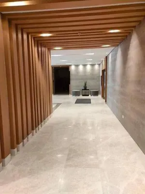 an empty hallway of an office building with a long corridor at S Residence Condo Near MOA,IKEA in Manila