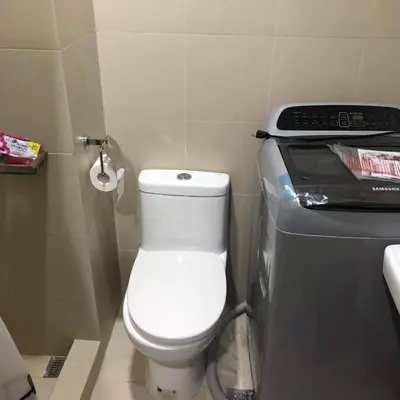 a small bathroom with a toilet and a printer at S Residence Condo Near MOA,IKEA in Manila