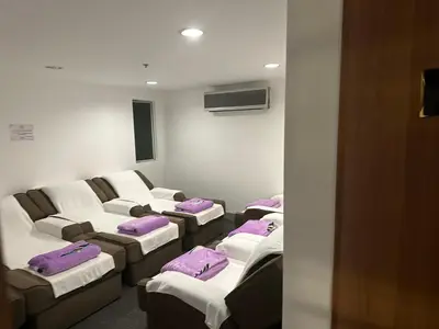 a room with a bunch of pillows on a couch at Jjimjbang hotel spa in Manila